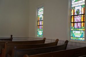 Windows and Pews inside Trinity Ev. Luth. Church
